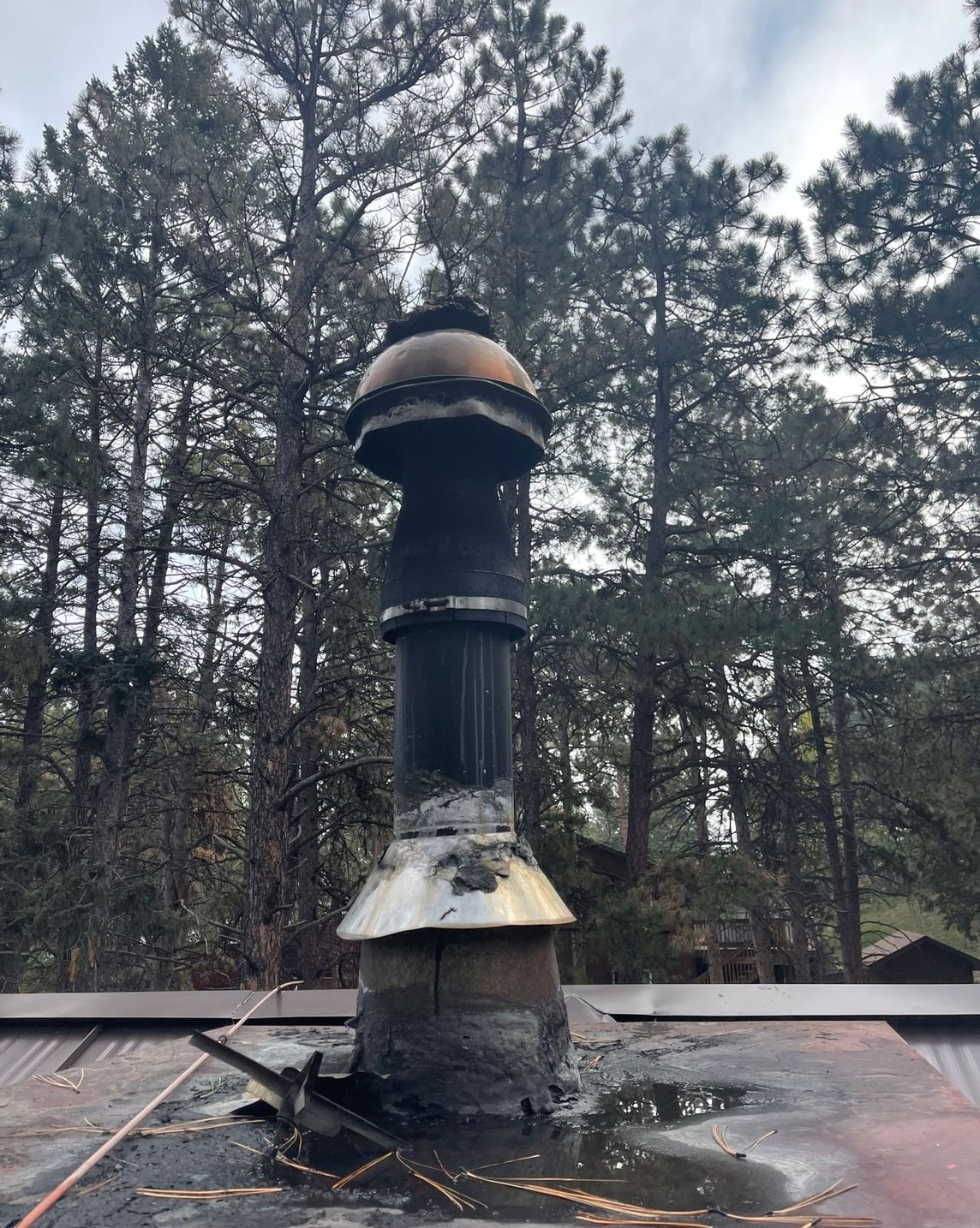 damaged chimney pipe and cap